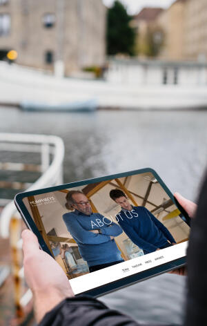 mockuuups ipad air mockup held by a user