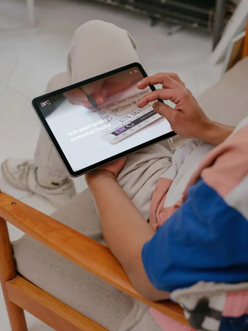 mockuuups male hands working on ipad air mockup