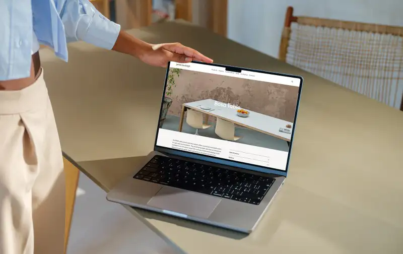mockuuups macbook pro 14 inch mockup with female hand on a modern desk