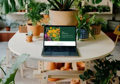 mockuuups macbook pro mockup amidst an indoor garden