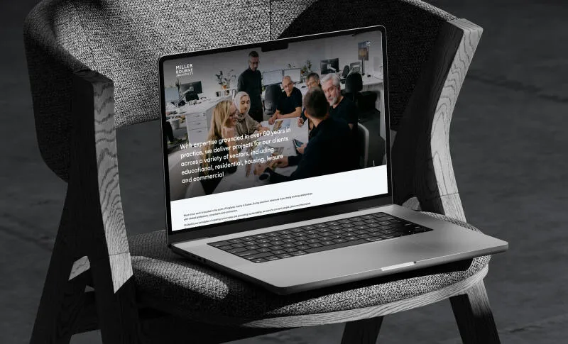 mockuuups macbook pro mockup on a textured chair with dramatic shadows