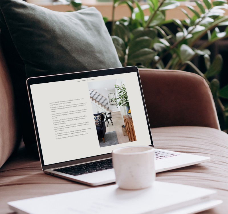 mockuuups macbook pro mockup on a sofa with coffee and documents