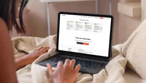 mockuuups ipad air mockup with a woman working in bed