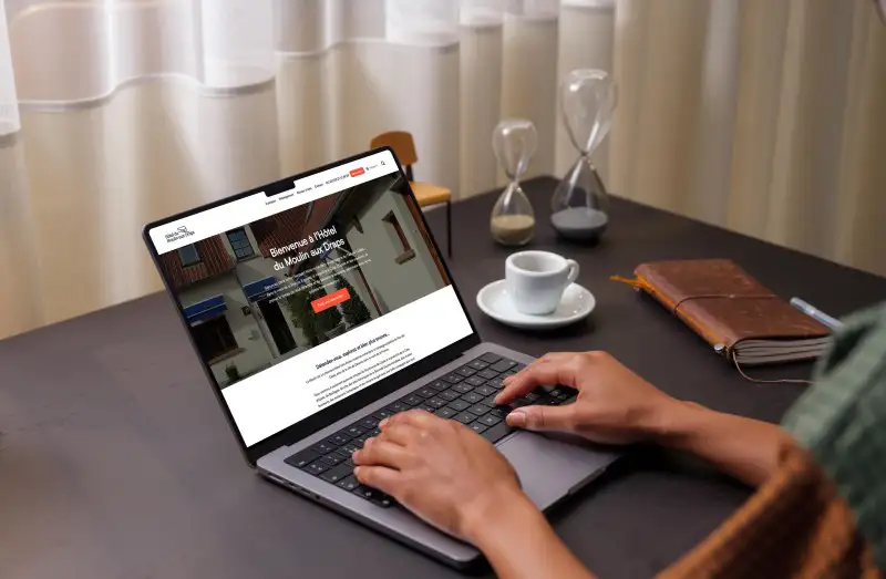 mockuuups user typing on a macbook pro 14 mockup