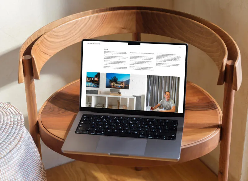 mockuuups macbook pro mockup on a round wooden table 1