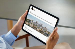 mockuuups ipad air mockup in a womans hand at a modern office