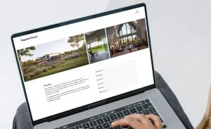 mockuuups grey macbook mockup on a users lap