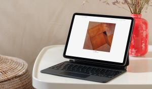 mockuuups ipad air mockup on a cozy home table with a decorative vase